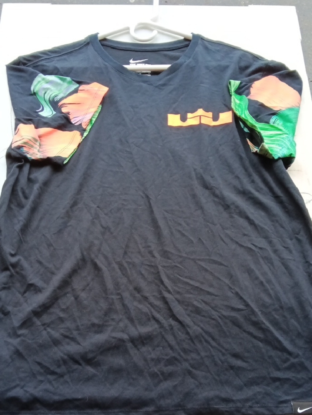 LeBron Crested Nike Black Tee with Orange Tropical Sleeve Print.